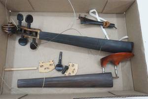lot 39 image: Violin Parts Neck, Fingerboard, pegs, tailpiece, chinrest, bridge