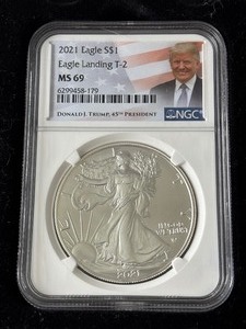 lot 34 image: 2021 Silver Eagle Donald Trump NGC MS69