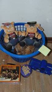 lot 421 image: Harley Davidson Stuffed Pigs, Tin Camel Tin and Ceramic Ford Truck