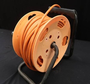lot 58 image: CORD REEL AND EXTENSION CORD