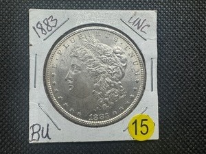 lot 15 image: 1883 Morgan Silver Dollar Marked BU-UNC When Purchased