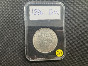 lot 20 image: 1886 Morgan Silver Dollar Marked BU When Purchased