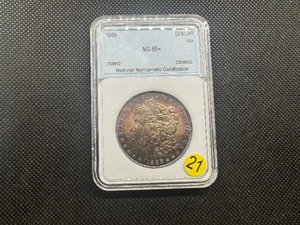 lot 21 image: 1886 Morgan Silver Dollar NMC MS65 Great Purple Toning