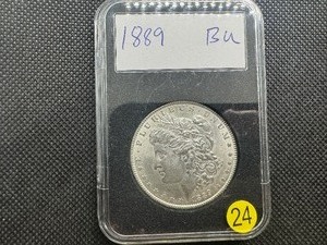 lot 24 image: 1889 Morgan Silver Dollar Marked BU When Purchased