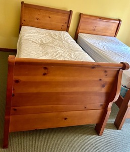 lot 128 image: Wood Twin Sleigh Bed with Mattress