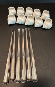 lot 65 image: Set of 12 Porcelain Shell Escargot Dishes with Forks and Bonus Shells