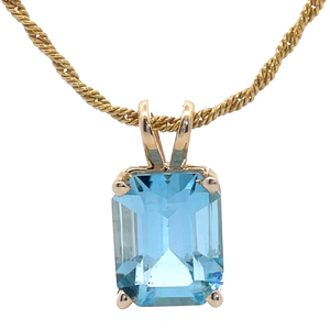 lot 39B image: Solitaire Blue Light Topaz Pendant in 14k Yellow Gold
