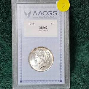 lot 7 image: 1922 Peace Dollar AACGS MS62 wNice Edge Toning