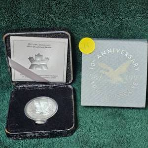 lot 11 image: 1997 10th Anniversary Silver Proof Loon Dollar