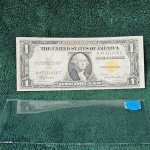 lot 92 image: 1935 A $1 Silver Certificate AFR WW II  (Backside Die Print Error)