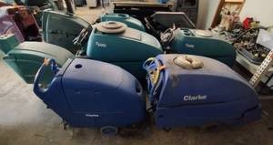 lot 24 image: 8 floor scrubbers, Including the following brands and models 2 Clarke, T600e Tennant, T500e Tennant, 2510, Nobles, T5e and Viper (none work)
