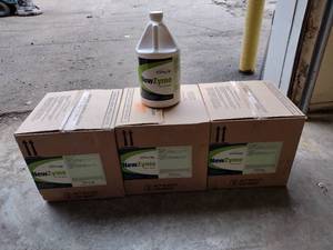 lot 125 image: 2 Boxes of 4 1 Gallon Jugs and 1 Box of 3 1 Gallon Jugs. New Line New Zyme Bacterial Digester