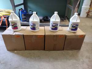 lot 130 image: 4 Boxes of 4 1 Gallon Jugs of Assorted Soap Daddy Deodorizers.