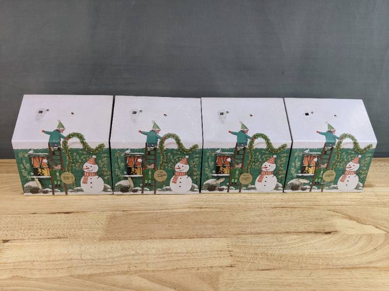 lot 345 image: 4 New M & S Foods Chocolate Chip Stars Santas Workshop Musical Light Up Tin N