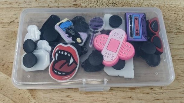 lot 104E image: 16 Brand New Olivia Rodrigo Music Character Croc Charms with Case N