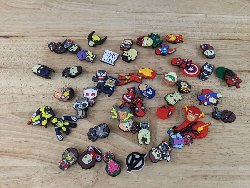 lot 43 image: Lot of 50 Brand New Croc Charms of Comic Book Characters N