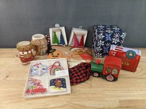 lot 151 image: Brand New Assorted Christmas Decor - Tree Skirt, Gift Boxes, Gift Tags, Santa Mailbox Cookies, and More N
