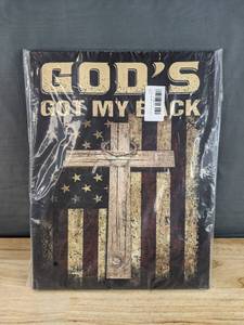 lot 179 image: Brand New Canvas Wall Art Gods Got My Back with Rustic Wooden Cross and American Flag Background 12x16 N