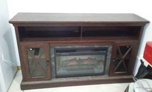 lot 1 image: Whalen Entertainment Center with Fireplace Heater Insert.