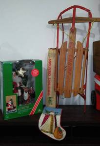 lot 5 image: Champ-Pette Sled, Animated Santa, and More.