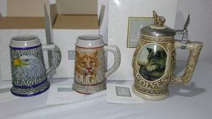 lot 9 image: Avon Fine Collectible Steins (3)  Eagle, Cougar, Wolf