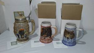 lot 28 image: Avon Fine Collectible Steins (3) American Wildlife, Mustang, Grey Wolf.
