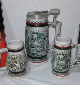 lot 103 image: Avon Age of the Iron Horse Mini Stein (3) Large (1) and Car Classic Mini.
