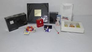 lot 129 image: Avon Fantasque Gift Sets, Little Black Dress and More.