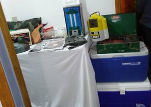 lot 91 image: Camping Assortment. Coleman Igloo Coolers, Flow Troll, Lantern, Land Guide and more.
