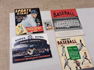 lot 440 image: Collectors Items - Cal Ripkin Sports Card (in sleeve), Super Bowl XX Bears  Patriots 1986-1987 Calendar, Magazines -Sports Stars, Baseball Magazine, Complete Baseball