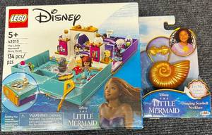 lot 16 image: Sealed New Disney Princess Little Mermaid The Little Mermaid Story Book Lego Set 43213 & Singing Seashell Necklace