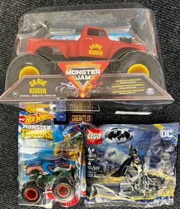 lot 31 image: All New - Monster Jam Grave Digger (XL truck) 124 Truck - Hot wheels Monster Trucks Cage rattler & New Lego Batman