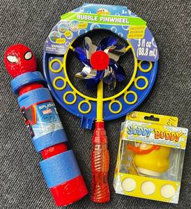 lot 41 image: Out Door Fun, Spiderman Water GunSquirter, Bubble Blower Pinwheel, and Suddy Buddy Duck for Bubble Bath Time