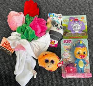 lot 53 image: Bendable Flower Boquet, Cry Babies Doll & More