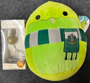 lot 71 image: Harry Potter Snitch Clip Light & Slytherin Snake Squish mallow Plush