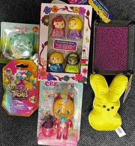 lot 76 image: New Mineez Trolls Collectibles (2 in pack), Bubble Popper key chain game, Cry Babies Doll, Princess Flavored Lip Gloss, Pin Art Toy & Peeps Plush.