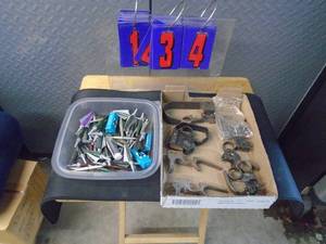 lot 134 image: Flat of misc vintage trigger assemblies & archery broad heads & gun mats. As shown.