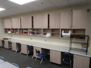 lot 133 image: Sewing Center (7) Lower Cabinets 21x27x29, Countertop 28x22, (6) Upper Cabinets 12x42x48 (has been disassembled)