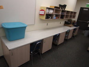 lot 132 image: Sewing Center (5) Lower Cabinets 21x27x29, Countertop 28x15 6, (3) Upper Cabinets 12x18x42 (has been disassembled)