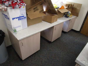 lot 134 image: Sewing Center (3) Lower Cabinets 21x27x29, Countertop 29x8 6 (has been disassembled)