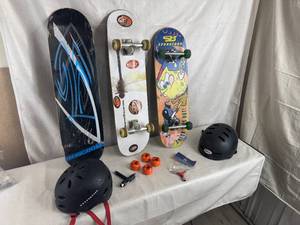 lot 28 image: Skateboards and Helmets