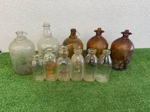 lot 151 image: Glass Milk Bottles & Large Glass Containers