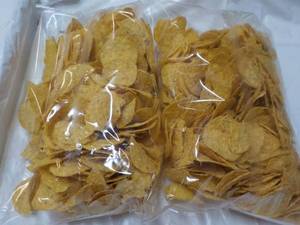 lot 196 image: 2 Bags Yellow Round 2 lb. Bags Tort...