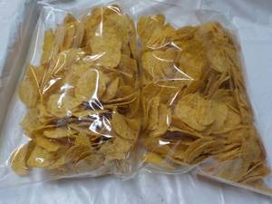 lot 197 image: 2 Bags Yellow Round 2 lb. Bags Tort...