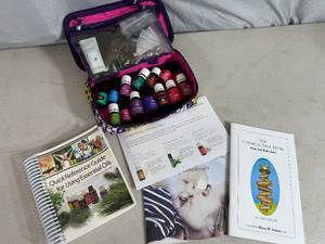 lot 35 image: Young Living Essential Oils with Case, Droppers, Books, Etc