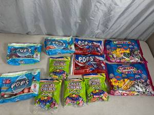 lot 124 image: Assorted Candy, Tootsie Pops, Fruit Chews, Blow Pops, Sugar Babies, and More