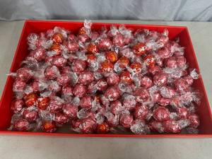 lot 156 image: 4.5 lbs of Lindt Lindor Chocolate Truffles and Strawberries and Cream
