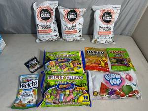 lot 243 image: Assorted Candy, Chocolate Popcorn, Fruit Chews, Blow Pops, Gummies, and More