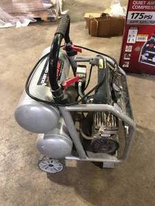 lot 37 image: Husky 4.5 Gal. 175 PSI Portable Electric Oil-Free Quiet Twin Stack Jobsite Air Compressor wRubber Wheels and 2-Quick Couplers For Parts  Customer Returns See Pictures