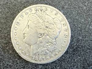 lot 9 image: 1897 O Morgan Silver Dollar
